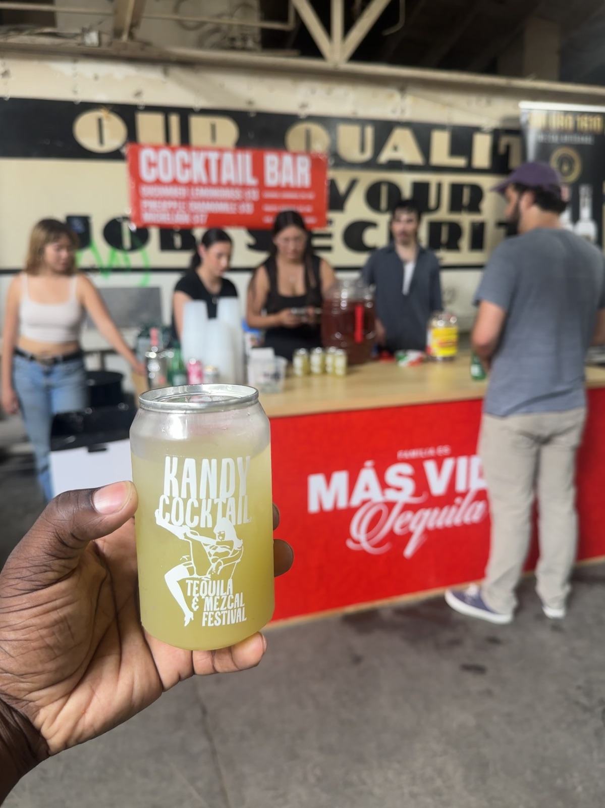 Kandy Cocktail drink in front of the finished event bar